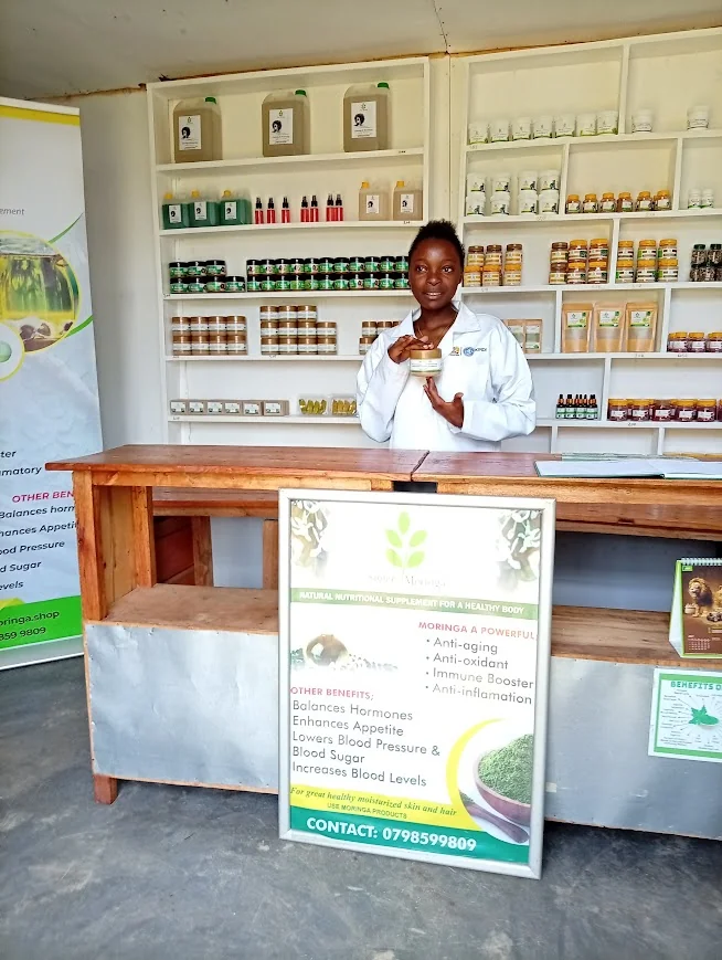 Natural herbal soaps and wellness products on a wooden surface